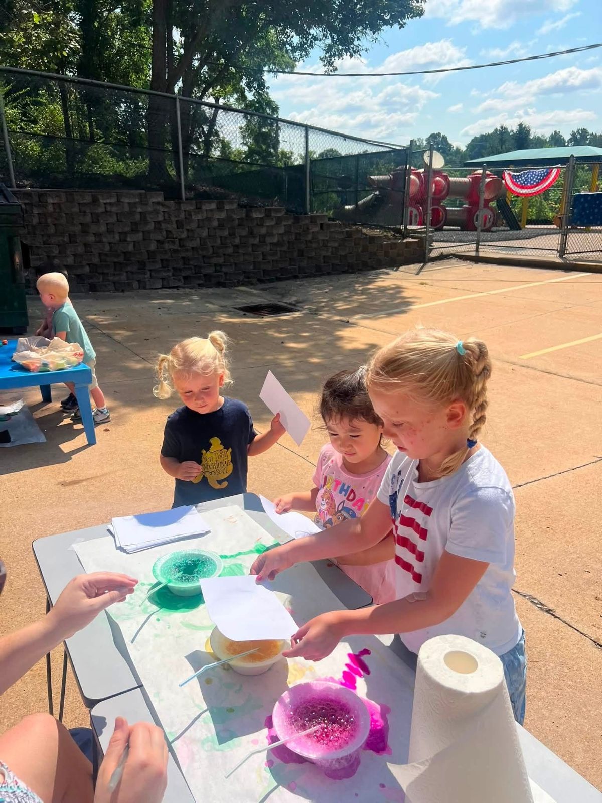 Children doing summer crafts outdoors